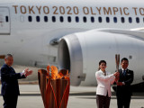Олимпийский огонь доставили в Японию